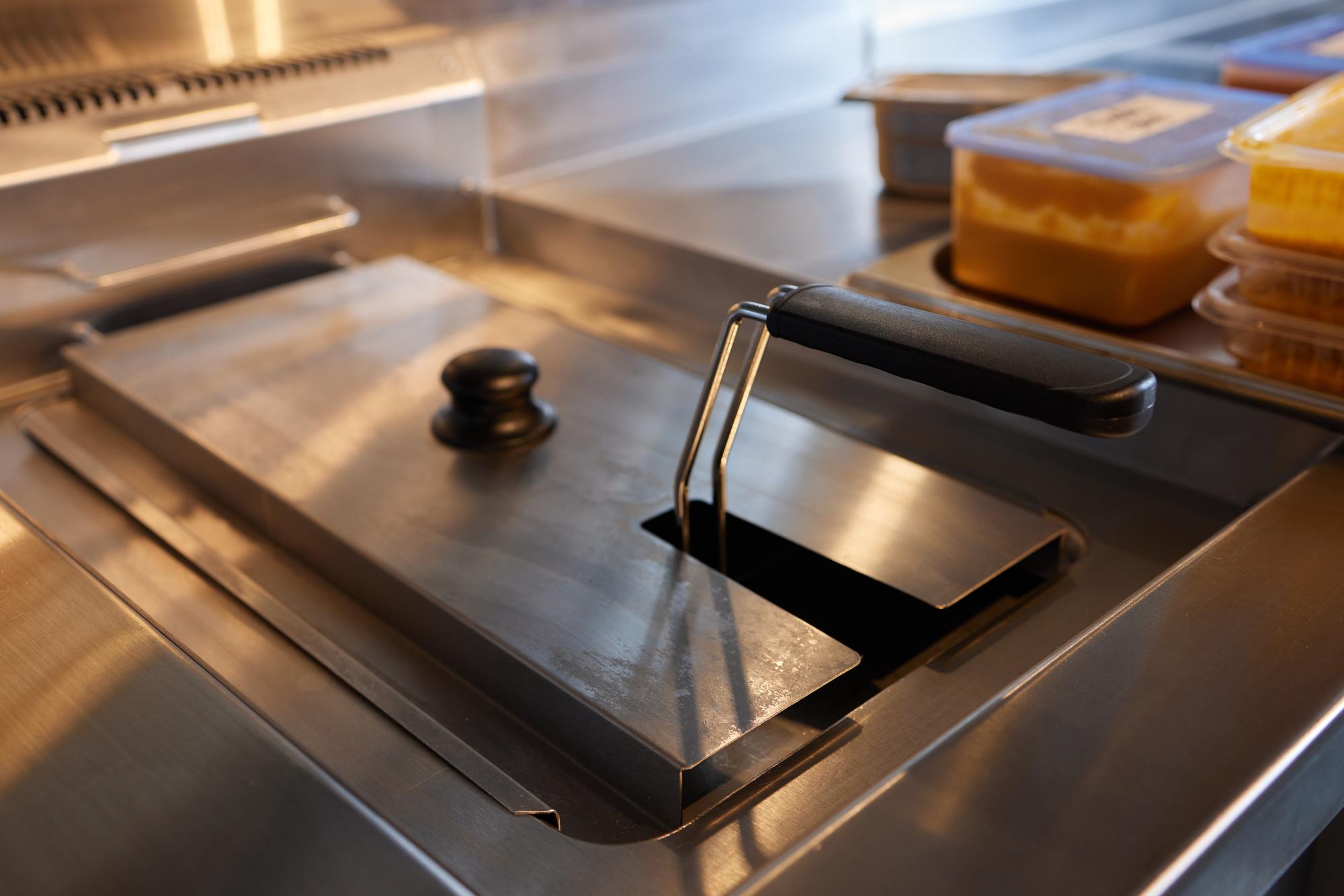 Interior of culinary atelier with stainless surfaces