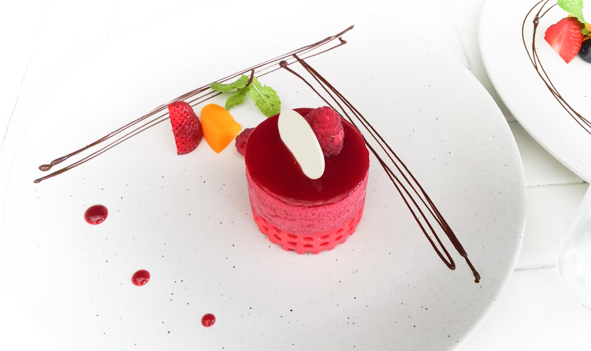 Close-up of plated dessert with technical garnish